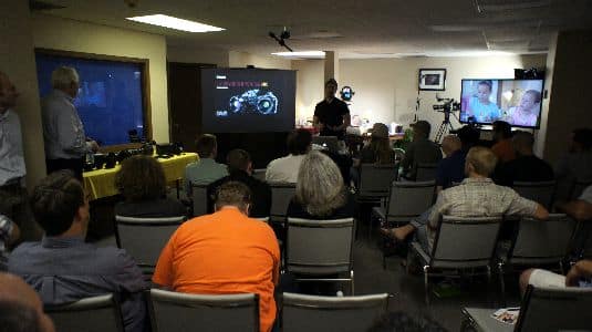 Seminar room layout including the projector and live models